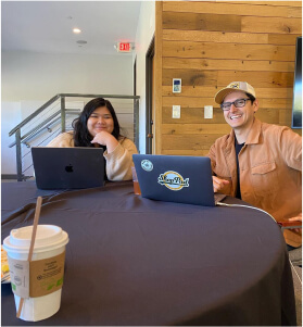 teammates working together during company Summit event