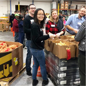 teammates helping at the local food bank
