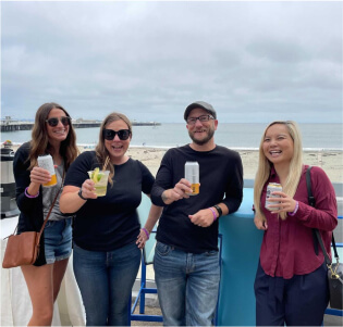 teammates cheering our first company retreat in Santa Cruz California